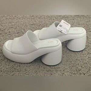 New white Mango platform slides. Size 36.